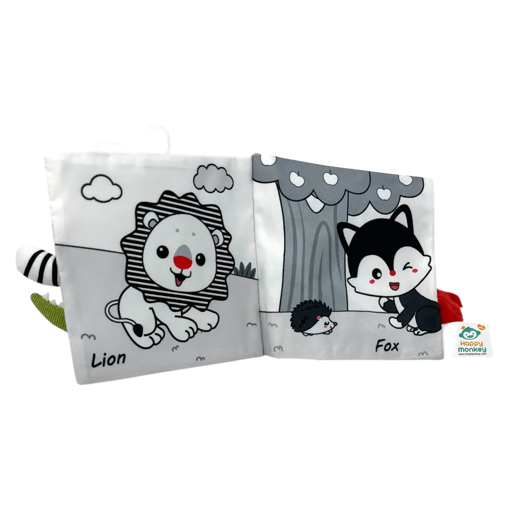 A black and white cotton fabric baby book, open